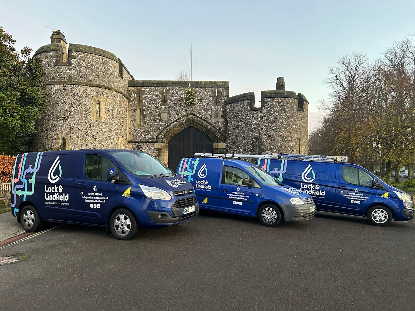 Lock and Lindfield fleet of vans outside Arundel castle walls