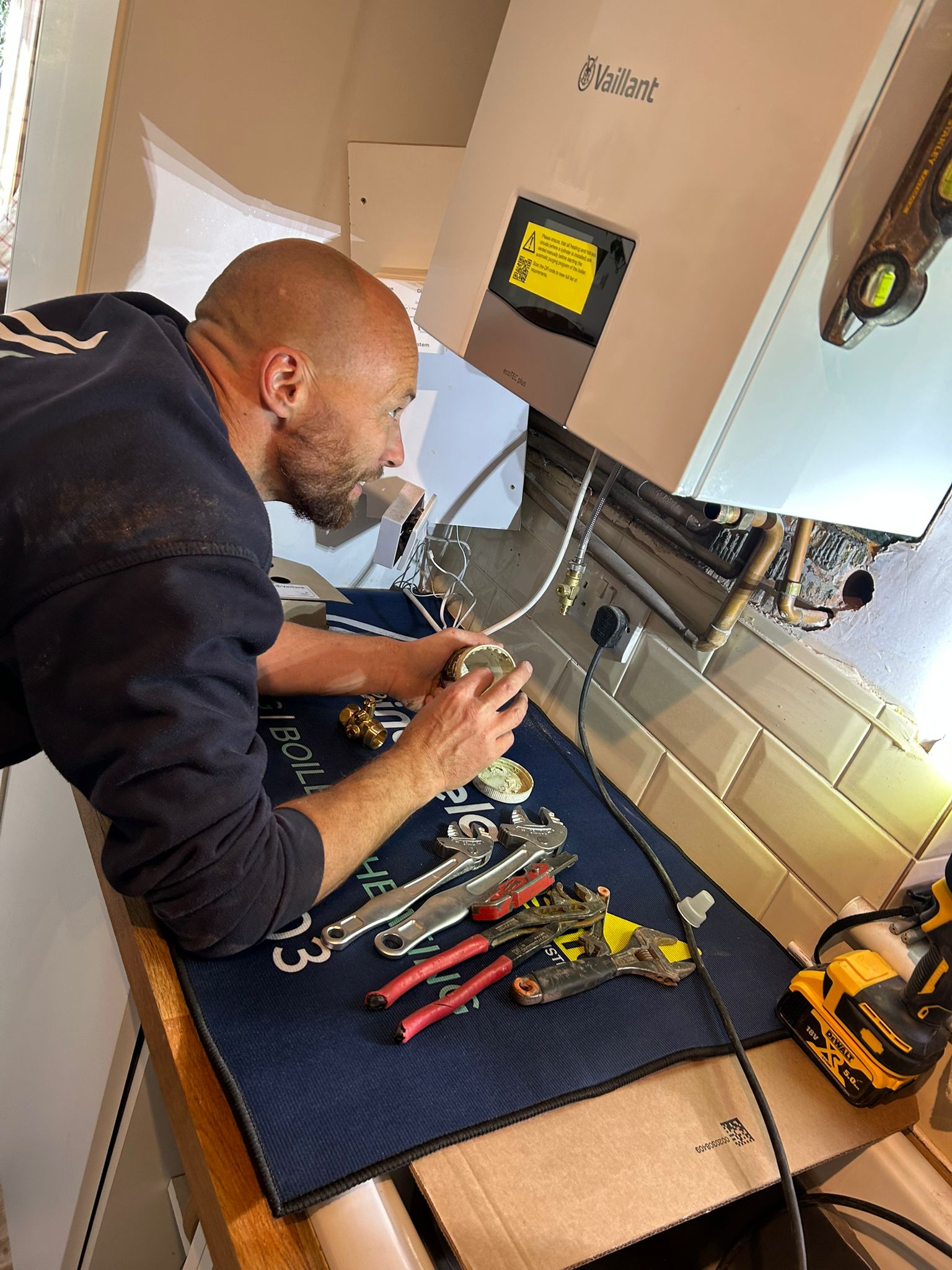 Lock & Lindfield engineer working on Vaillant boiler