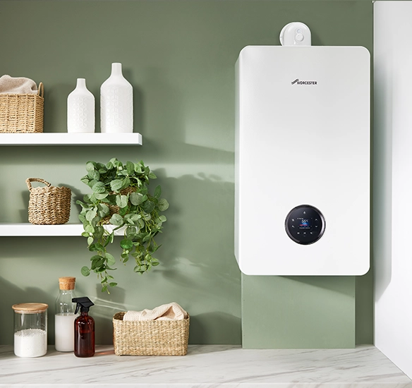 Modern boiler on a green wall