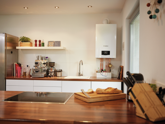 Modern warm kitchen with combi boiler